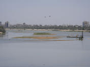 Significantly lower water levels are seen on the Tigris River, in Baghdad, Iraq, Saturday, May 28, 2022. At a time when worldwide prices for wheat have soared due to Russia's invasion of Ukraine, Iraqi farmers say they are paying the price for a government decision to cut irrigation for agricultural areas by 50% due to severe water shortages arising from high temperatures, drought, climate change and ongoing water extraction by neighboring countries from the Tigris and Euphrates rivers - all factors that have heavily strained wheat production. (AP Photo/Hadi Mizban)