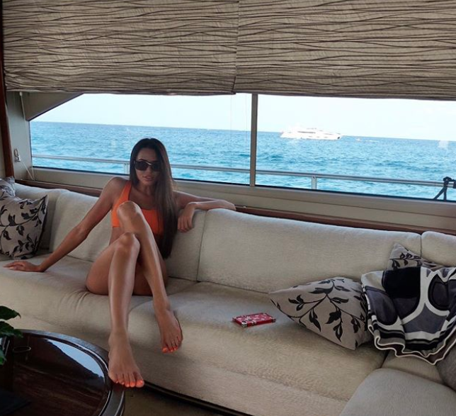 The picture showed Anastasia lounging on a lounge on a yacht, wearing an itsy-bitsy orange bikini. Photo: Instagram