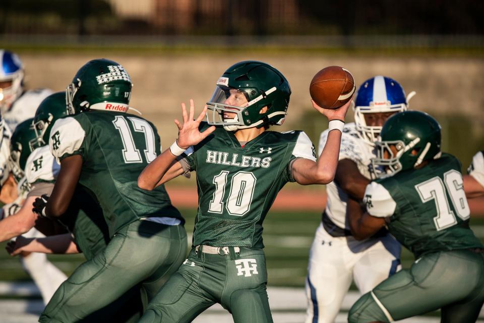 Tower Hill Hillers quarterback Michael Waesco (10) prepares to throw a pass against Howard Vo-Tech Wildcats during the high school football game at Tower Hill DeGroat Field, Friday, Oct. 28, 2022. Howard won 40-6.