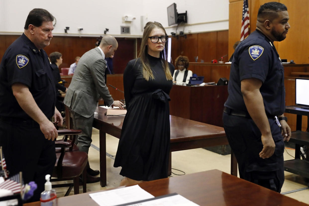 FILE — Anna Sorokin leaves after sentencing at New York State Supreme Court, in New York, May 9, 2019. A U.S. immigration judge cleared the way Wednesday, Oct. 5. 2022, for fake German heiress Anna Sorokin to be released from detention to home confinement while she fights deportation, if she meets certain conditions. (AP Photo/Richard Drew, File)