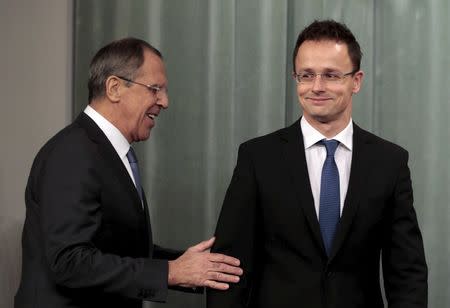 Russian Foreign Minister Sergei Lavrov (L) and his Hungarian counterpart Peter Szijjarto attend a news conference in Moscow in this November 19, 2014 file photo. REUTERS/Sergei Karpukhin/Files