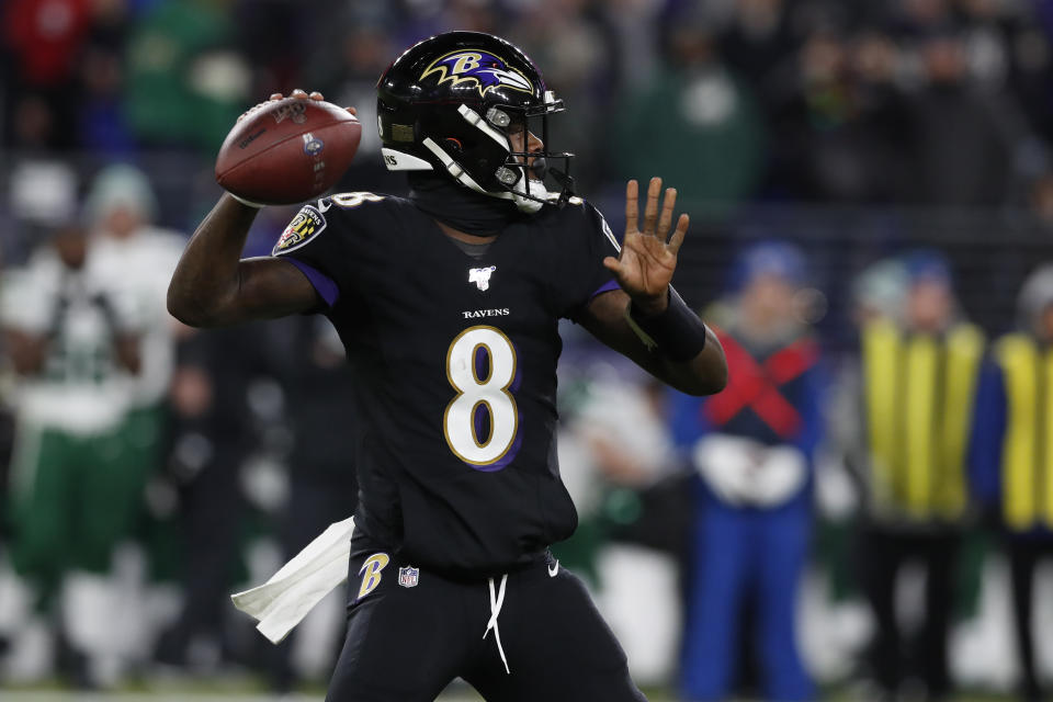 BALTIMORE, MARYLAND - DECEMBER 12: Quarterback Lamar Jackson #8 of the Baltimore Ravens throws the ball during the first quarter against the New York Jets at M&T Bank Stadium on December 12, 2019 in Baltimore, Maryland. (Photo by Todd Olszewski/Getty Images)