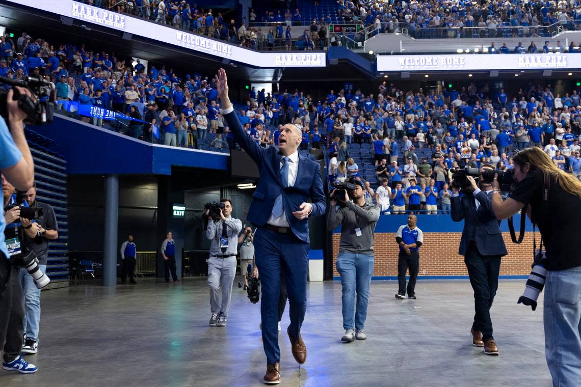 New Kentucky basketball head coach Mark Pope walks around Rupp Arena after making comments and answering questions from reporters during an introductory event Sunday.