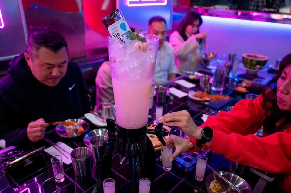 A group of friends from Connie Van Real Estate Group enjoy the lychee Soju at the newly opened Z Town Asian Gastro Bar in Elk Grove.