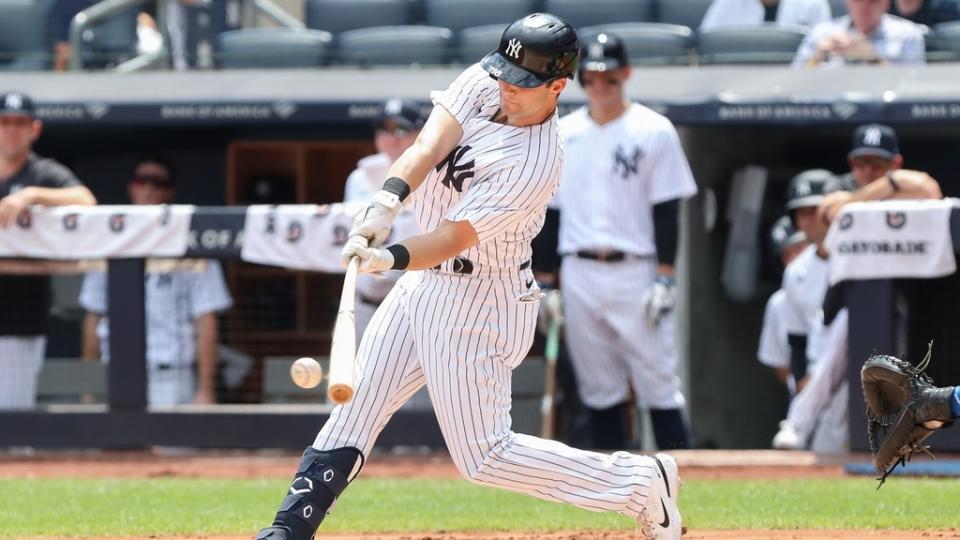 Aug 20, 2022;  Bronx, New York, USA;  New York Yankees left fielder Andrew Benintendi (18) hits a single against the Toronto Blue Jays during the first inning at Yankee Stadium.