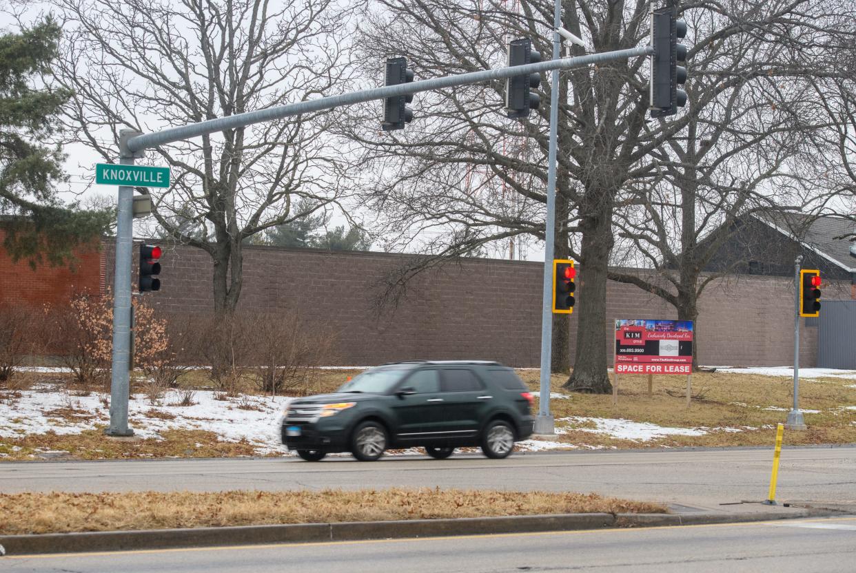 A large wall stands along the Keller Station boundary at the three-way intersection of Prospect Road and Knoxville Avenue. A proposed entrance to Keller Station at the intersection would involve knocking the wall down and adding an extension to the intersection, making it a four-way stop.
