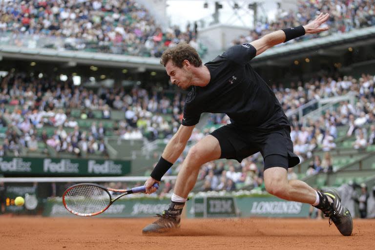 Great Britain's Andy Murray returns the ball to Portugal's Joao Sousa during the men's second round of the Roland Garros 2015 French Tennis Open in Paris on May 28, 2015