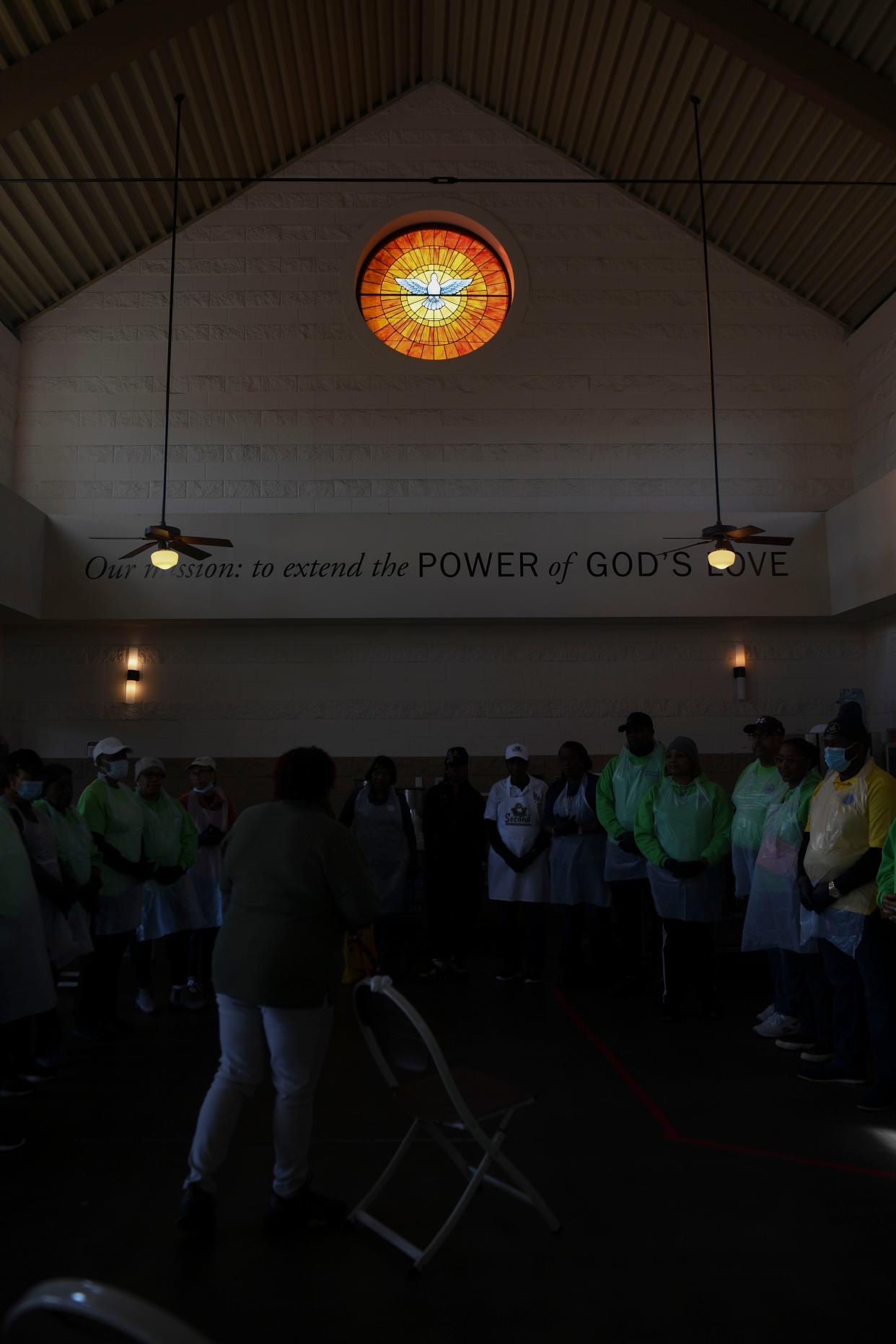 Volunteers are given instructions during the second annual MLK Day of Service at The Master's Table on Monday, Jan. 15, 2024. Golden Harvest Food Bank prepared to serve about 300 lunches, in addition to medical screenings by Augusta University students, and showers through Project Refresh.