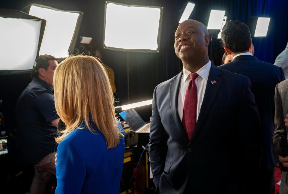 Sen. Tim Scott of South Carolina is interviewed in the spin room after the GOP presidential primary debate Wednesday night in Miami.