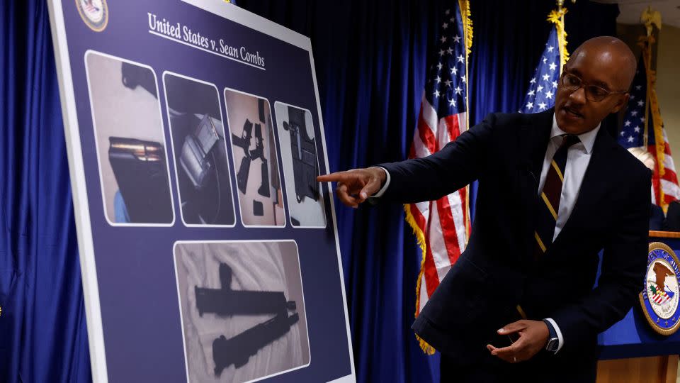 US Attorney Damian Williams pointed at a chart Tuesday showing the firearms seized during the search of Sean "Diddy" Combs' homes. - Shannon Stapleton/Reuters