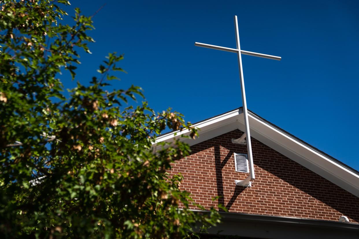 A cross is fixed to the outside of the Mennonite Fellowship in downtown Fort Collins on Aug. 31, 2023. Activities and clutter associated with the church's homeless ministry has received criticism from some neighbors and violations from the city.