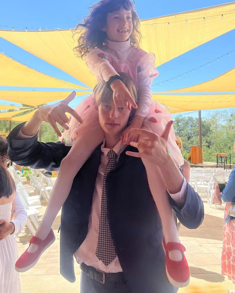 Liv Tyler's daughter Lula Rose looking adorable in a strawberry print dress for her brother's graduation