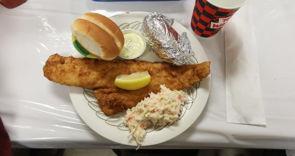 The popular fish fry at the Fairville Volunteer Fire Department comes with cole slaw, baked potato, roll, apple sauce, tarter sauce and lemon. Not pictured are the milk and ice cream that come with the meal.