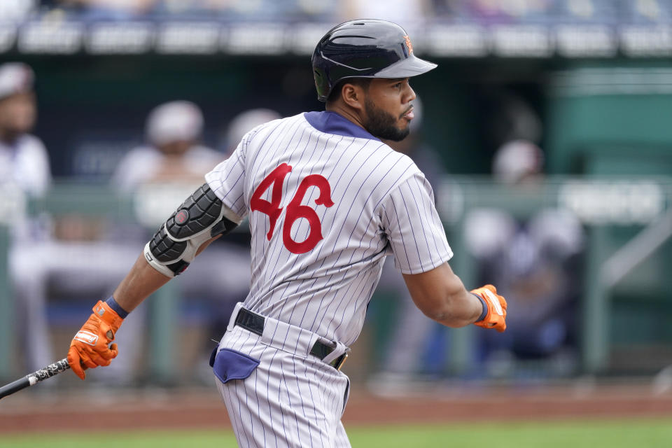 Detroit Tigers' Jeimer Candelario hits an RBI single during the first inning of a baseball game against the Kansas City Royals Sunday, May 23, 2021, in Kansas City, Mo. (AP Photo/Charlie Riedel)