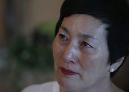 Kim Young-ja, a sister of Kim Young-nam who is a South Korean abductee living in North Korea, cries during an interview with Reuters in Jeonju July 2, 2014. REUTERS/Kim Hong-Ji