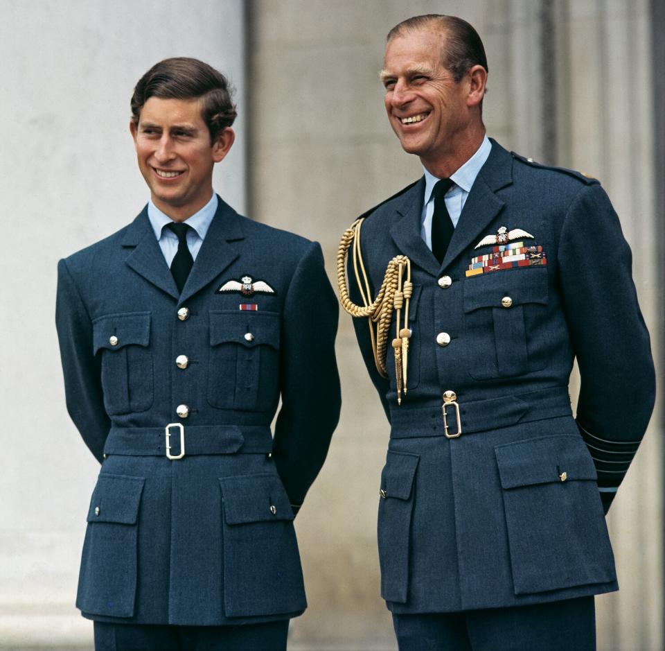 Prince Charles, the Prince of Wales, receives his wings at RAF Cranwell in Lincolnshire, UK, 20th August 1971. On the right is his father, the Duke of Edinburgh (1921 - 2021), who is Marshal of the Royal Air Force.