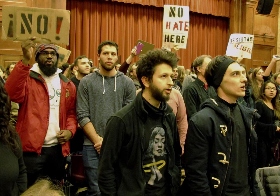 Middlebury College students turn their backs on Charles Murray, unseen, during his lecture in Middlebury, Vt., on March 2, 2017. Hundreds of college students protested the lecture. (Photo: Lisa Rathke/AP)