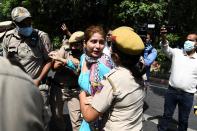 Police detain a Congress Party activist during an anti-government demonstration to protest against the recent passing of new farm bills in parliament in New Delhi on September 28, 2020. (Photo by Sajjad HUSSAIN / AFP) (Photo by SAJJAD HUSSAIN/AFP via Getty Images)