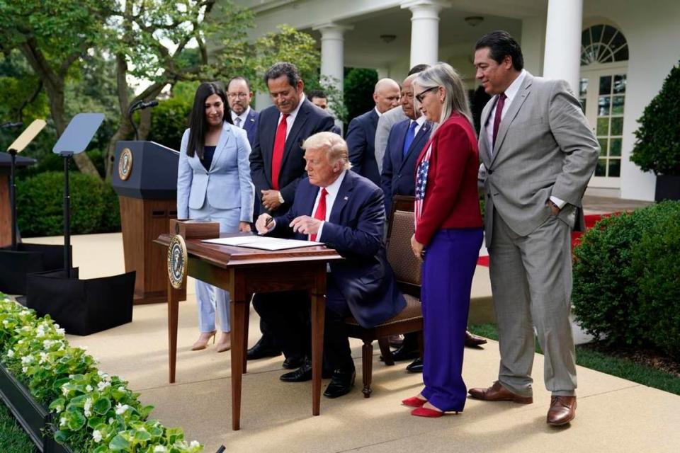 President Trump signs an executive order creating the White House Hispanic Prosperity Initiative on July 9.