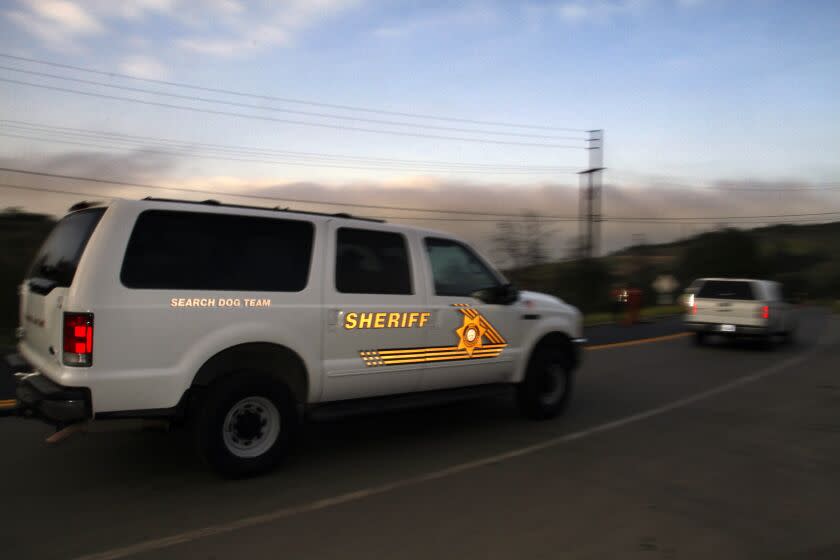 Khan, Irfan –– B582082433Z.1 BREA, CA, May 04, 2012 ––– A San Bernardino County Sheriff search dog team leaves Olinda Alpha Landfill in Brea on early Friday morning. Olinda Alpha Landfill is a place where according to Orange police Sgt. Dan Adams investigators searched for the bodies of missing mom and her two sons. Earlier at press conference Sgt. Adams announced taking into custody A man taken into custody Shazer Fernando Limas, 31, at the end of a vehicle chase through South Orange County, on suspicion of murdering his former live–in girlfriend and their two young sons. Limas was arrested by California Highway Patrol officers on Interstate 5 south of the San Onofre weigh station in San Diego County around 7:45 p.m. Thursday, said Orange police Sgt. Dan Adams. Police began looking for Limas and the missing woman, 31–year–old Arlet Hernandez, and her children after finding blood at noon Thursday along with other evidence of an altercation in a vacant apartment they had shared at 3063 W. Chapman Avenue, Orange. (Irfan Khan/Los Angeles Times)