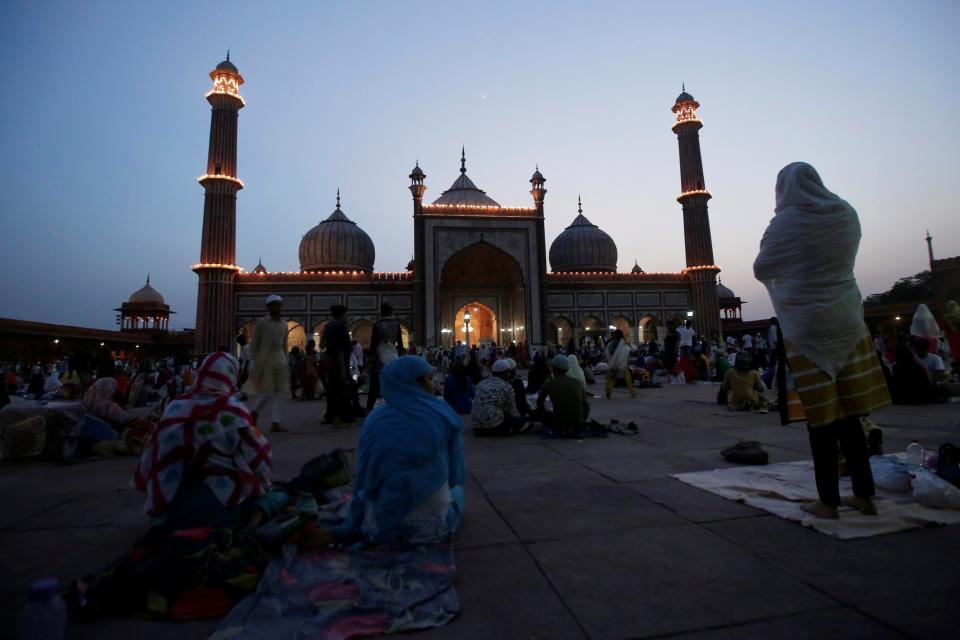 <p>A Muslim woman prays after having her iftar (breaking fast) meal on the first day of Ramadan at the Jama Masjid (Grand Mosque) in the old quarters of Delhi, India, May 28, 2017. (Adnan Abidi/Reuters) </p>