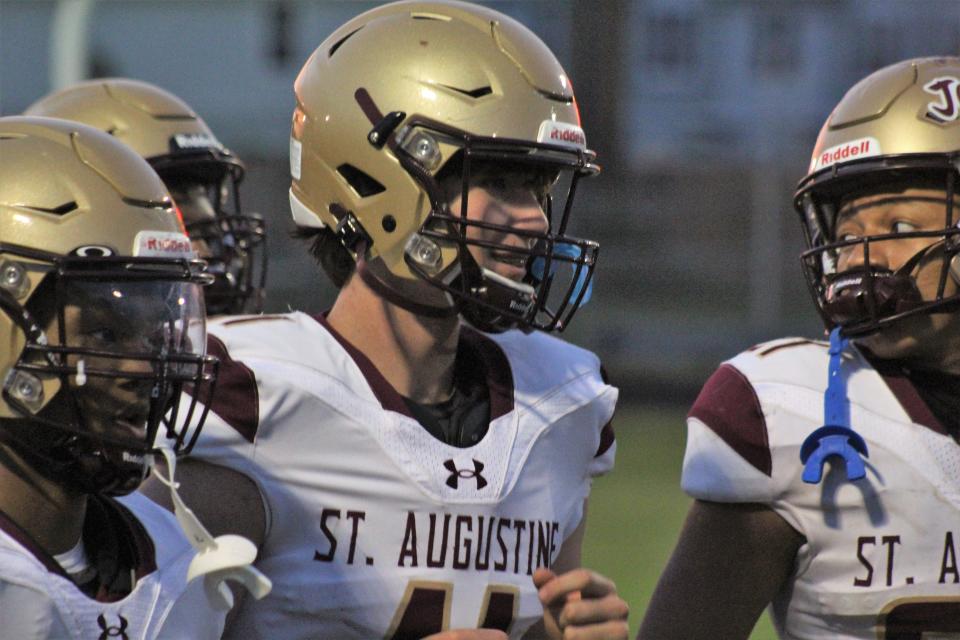 Locklan Hewlett talks with teammates during a jamboree with Mandarin, St. Augustine and Bishop Kenny on Wednesday.