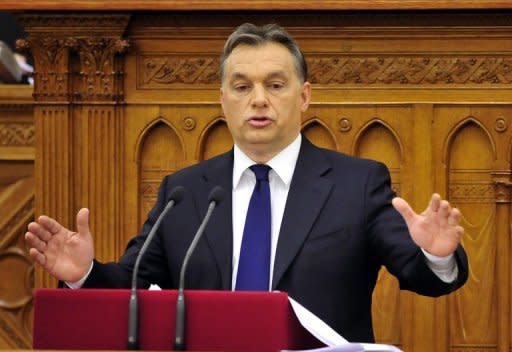 Hungarian Prime Minister Viktor Orban delivers a speech in the main hall of the parliament building in Budapest. Orban is so secure domestically that he can ignore the current storm of foreign criticism, but moves to increase control over the central bank could be his Achilles heel