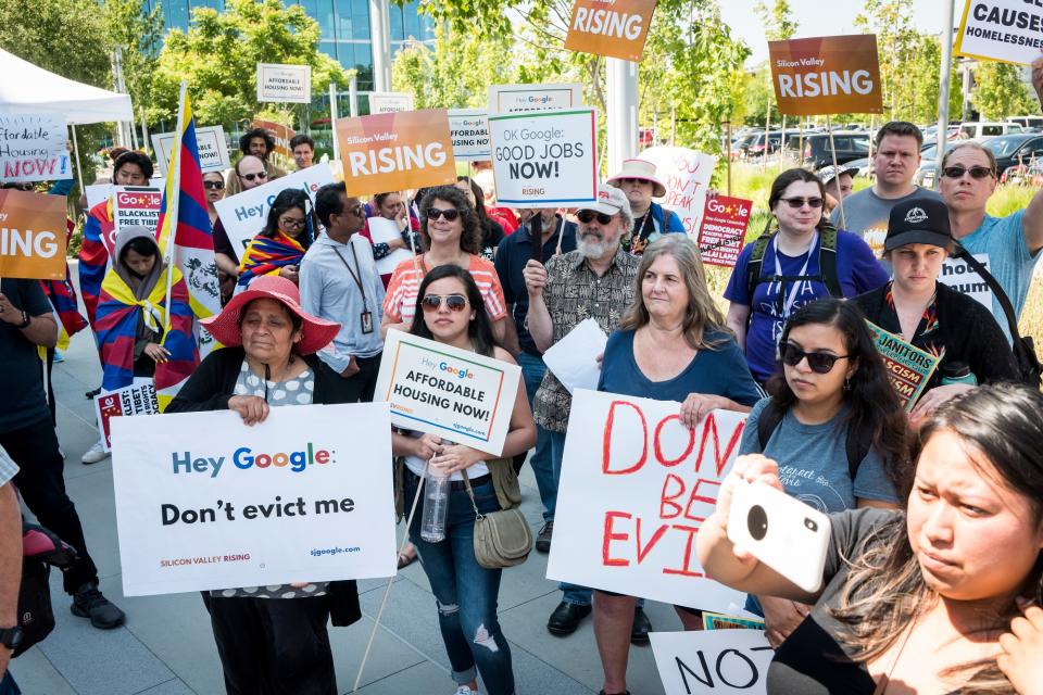 (Bloomberg) -- Google workers, shareholders and activists used the annual meeting of parent Alphabet Inc. to protest a range of issues, including contractor rights, the tech giant’s business in China and the absenteeism of Alphabet Chief Executive Officer Larry Page.Shareholders filed proposals asking Alphabet management to scrap non-compete agreements, claw back compensation from executives who were found to have harassed employees and put an employee representative on its board.Several activist groups, sometimes in conjunction with Google employees, protested outside the meeting and at company offices around the world. Topics include diversity, ethics around product launches, housing affordability and working conditions for temporary and contract staff.About 30 protesters, including Google workers and outside activists, gathered outside the event holding signs that read "Not OK Google" and "Google creates homelessness." Tibetan, Uighur and Chinese rights activists called on Google management to clearly confirm the company will not re-establish business relations with China, citing what they said is the government’s mass surveillance and human-rights abuses.Google CEO Sundar Pichai said the company’s huge scale comes with a “deep sense of responsibility to create things that improve people’s lives” and benefit society as a whole. Executive Chairman John Hennessy said Alphabet’s board of directors is making sure the company focuses on diversity, sustainability and societal impact. “We are deeply committed to do the right thing on these issues,” he said.The meeting is the latest flare-up in a roughly two-year effort by some Google employees and outside activists to push the company to be more accountable to workers, stockholders and the communities where it operates.Listen to a Google insider’s account of the protests from Bloomberg’s Decrypted podcast.Google has a famously open work culture, where employees of all levels are encouraged to speak their mind and suggest changes to company policy. That’s created some headaches for the tech giant. Google shelved a plan to build a censored search engine for China after news of the project leaked and employees rebelled against it. The company also stepped back from one military contract and stopped forcing employees to sign away their right to bring claims against it in court.Google’s critics only have so much power though. Shareholder proposals like the ones advanced at the annual meeting are almost always rejected because the company’s founders control the majority of the votes through special shares.“I was wondering where the CEO of Alphabet is. Year after year there’s no CEO here. It’s a glaring omission,” especially for someone with such a large stake in the company, one shareholder said during the meeting. Page and Google co-founder Sergey Brin control Alphabet through special voting shares, but they have stopped showing up at annual meetings in recent years.Chief Legal Officer Kent Walker responded, saying Page wasn’t able to attend this year. He has attended every board meeting, Walker said.The shareholder replied that the annual meeting is the only time investors have a chance to ask the CEO questions directly.Marie Collins, a Google employee who has worked there for about six years, said the company lacks accountability, citing Page and Brin’s absence as part of the problem. The executives rarely attend companywide employee meetings anymore, she added. Google used to have a good relationship with employees, but that changed about a year ago, Collins said.Google engineer Irene Knapp spoke in favor of a proposal to tie executive compensation to the company’s progress on diversity and inclusion. Knapp cited research by the group AI Now showing that bias in artificial intelligence technology is related to the lack of diversity in the industry.Other Google employees spoke in favor of proposals on adding a worker representative to the board and a call for a report on the impact of Google’s Dragonfly Chinese search project.While Ruth Porat, Google’s chief financial officer, spoke about autonomous vehicle technology, protesters outside the building chanted and shouted through loud speakers.“Alphabet sits at an inflection point,” facing antitrust investigations and other issues, one employee said, in support of the proposal to add a worker representative to the board. “It cannot afford to ignore the storm brewing.”(Updates with Google employee comments in 13th paragraph.)To contact the reporters on this story: Alistair Barr in San Francisco at abarr18@bloomberg.net;Gerrit De Vynck in New York at gdevynck@bloomberg.netTo contact the editors responsible for this story: Jillian Ward at jward56@bloomberg.net, Andrew Pollack, Robin AjelloFor more articles like this, please visit us at bloomberg.com©2019 Bloomberg L.P.