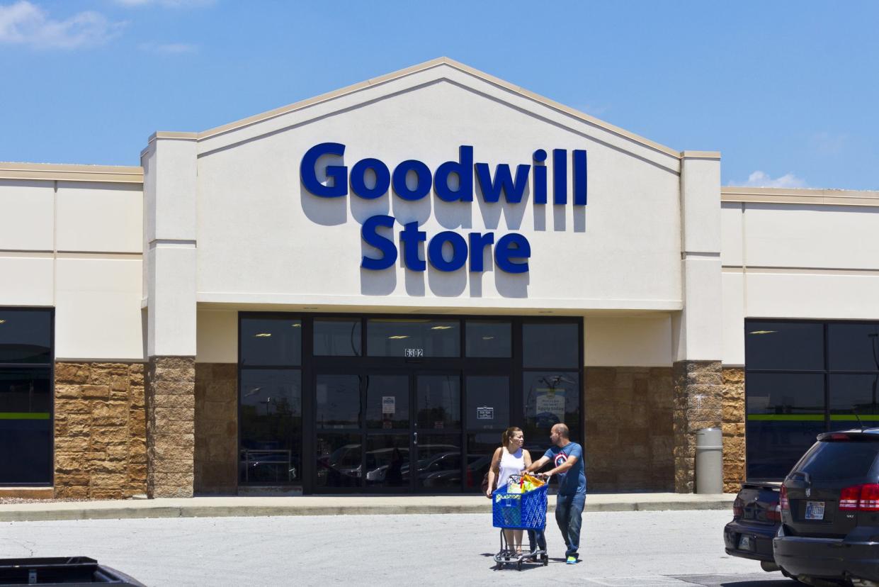 couple leaving goodwill storefront