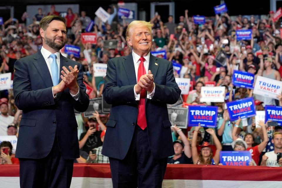 PHOTO: Former President Donald Trump and Republican vice-presidential candidate Sen. J.D. Vance arrive at a campaign rally, July 20, 2024, in Grand Rapids, Mich.  (Evan Vucci/AP)