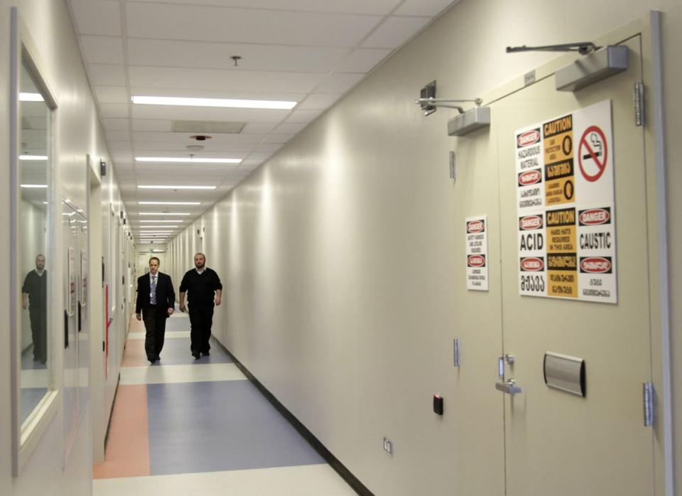 <div class="inline-image__caption"><p>Employees walk in the corridor during a media tour of the Central Public Health Reference Laboratory (CPHRL) in Tbilisi, March 16, 2011.</p></div> <div class="inline-image__credit">David Mdzinarishvili/Reuters</div>