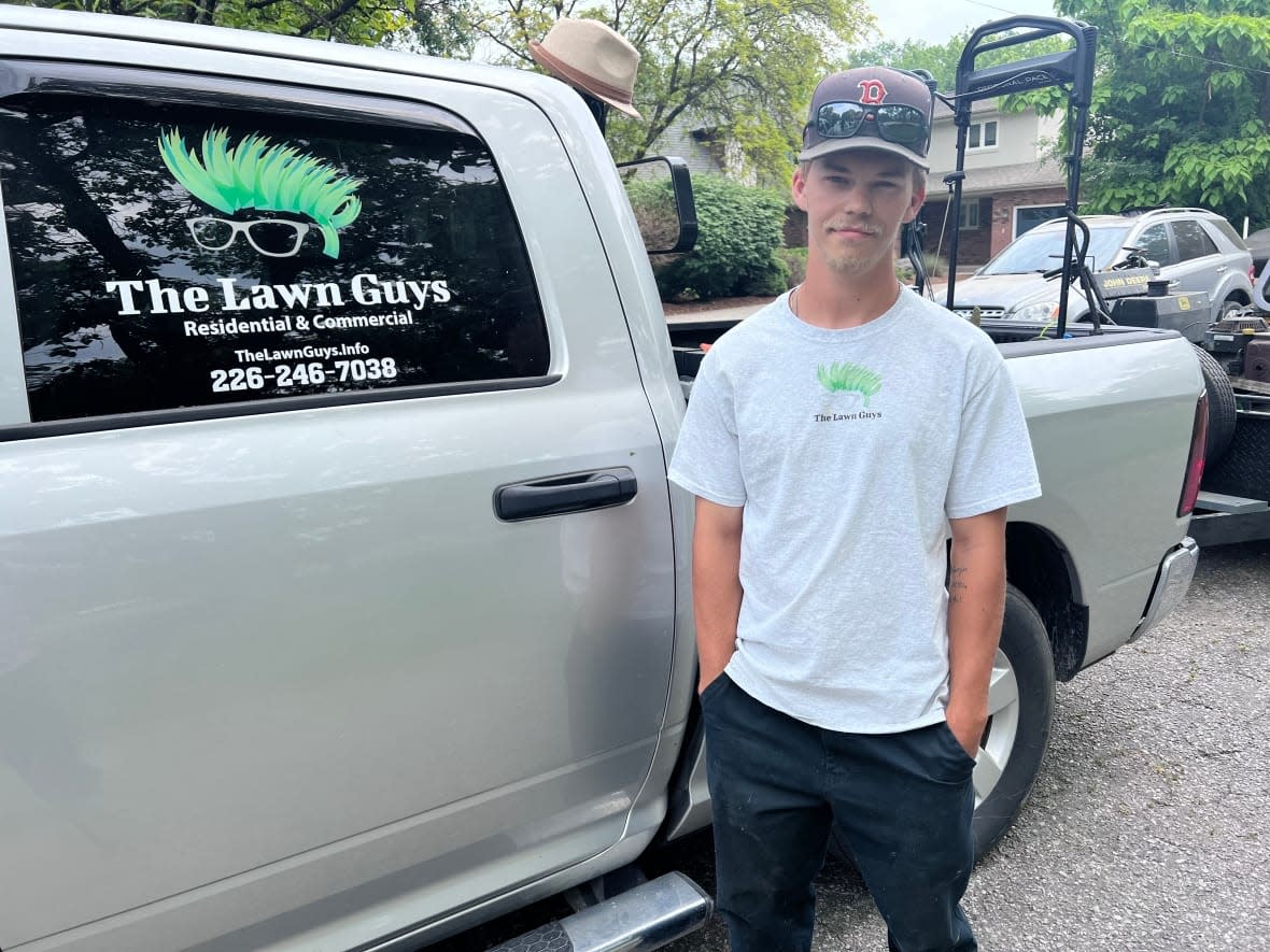 Colton Romanick is the owner and operator of The Lawn Guys. He said his team is halting some non-essential work, and encouraging workers to take extra breaks, amid poor air quality outside due to wildfire smoke.  (Jacob Barker/CBC - image credit)