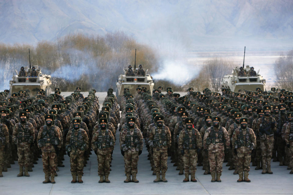 FILE - In this Jan. 4, 2021, file photo, Chinese soldiers rally while training in -20 degrees Celsius (-4 Fahrenheit) conditions in Kashgar in northwestern China's Xinjiang Uighur Autonomous Region. China appointed on Friday, Aug. 6, 2021 a new military commander in restive Xinjiang where authorities have locked up more than a million members of Muslim minorities in what they call a bid to curb terrorism and radicalism. (Chinatopix via AP, File)