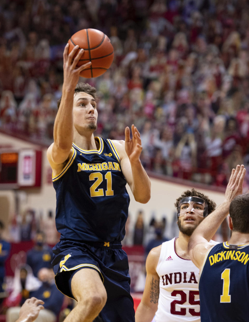 Michigan guard Franz Wagner (21) drives to the basket during the first half of an NCAA college basketball game against Indiana, Saturday, Feb. 27, 2021, in Bloomington, Ind. (AP Photo/Doug McSchooler)