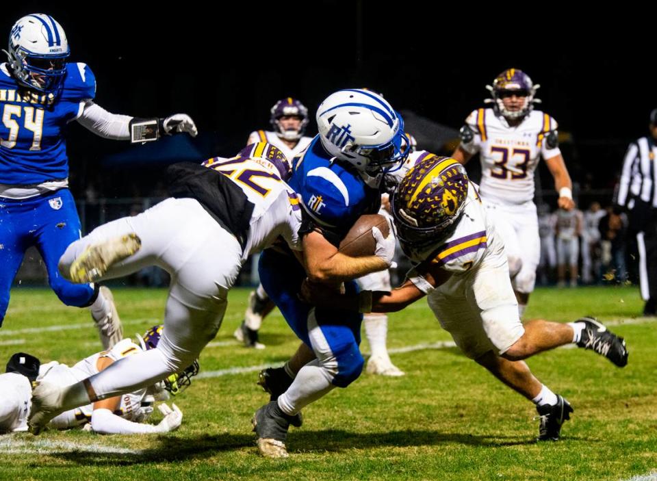 Ripon Christian’s Grant Sonke (25) gets sandwiched between Orestimba defenders in the Sac-Joaquin Section Division VII-A Championship against Orestimba at Ripon Christian High School on Friday, Nov. 17, 2023.