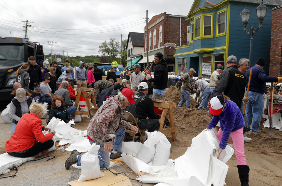 People filling sandbags