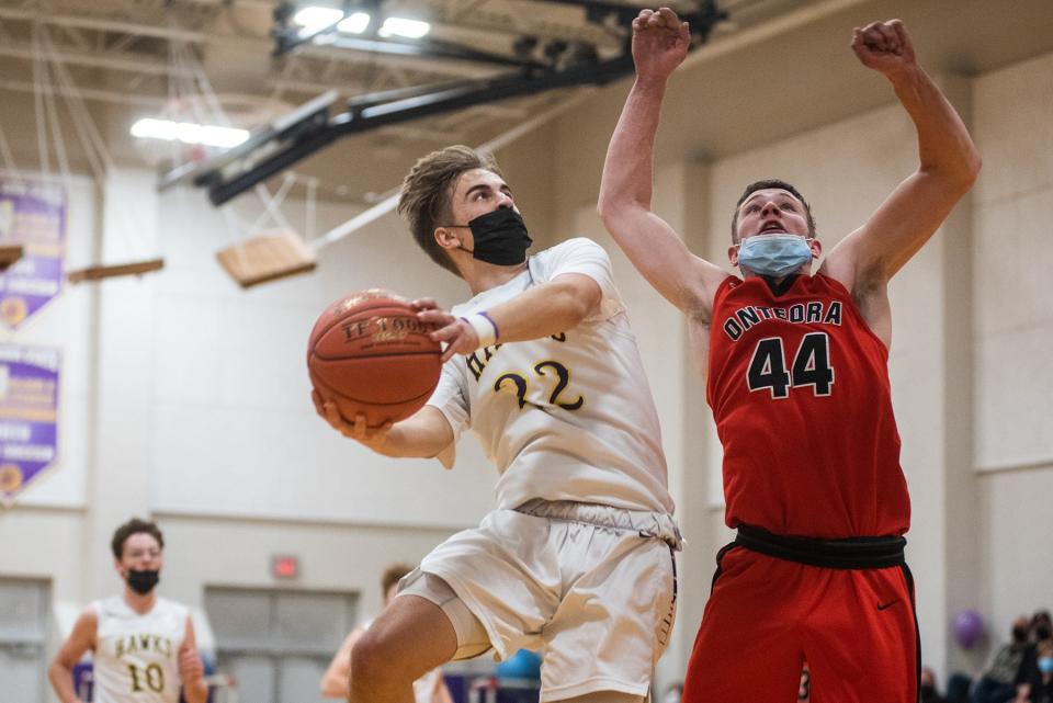 Rhinebeck's Jack Viator shoots as Onteora's Logan Holmquist attempts to defend on Friday in Rhinebeck.