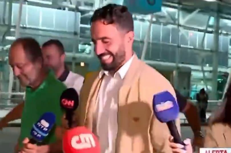 Ruben Amorim is questioned by reporters at Lisbon airport