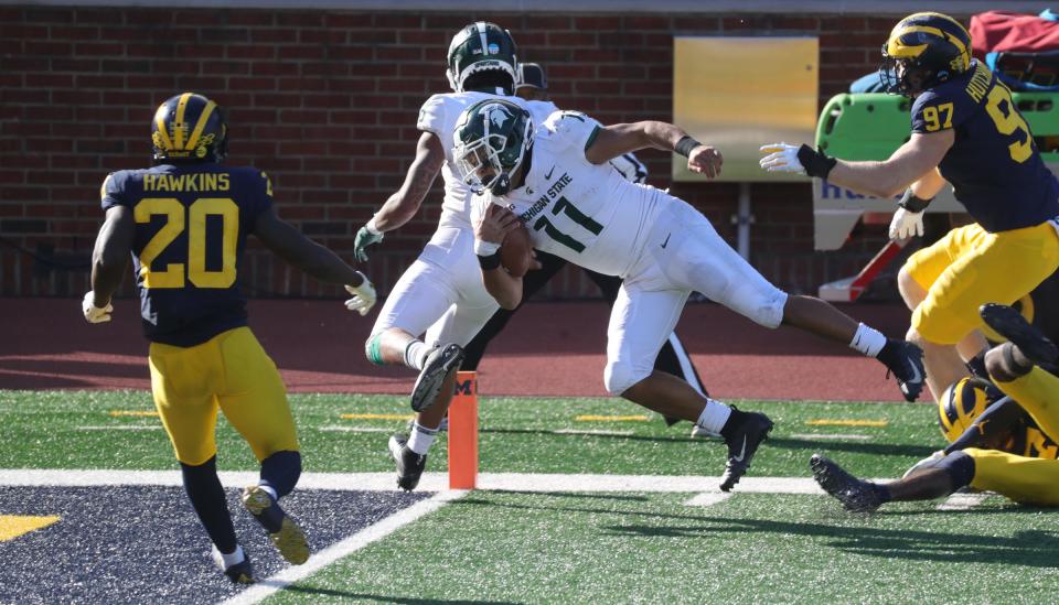 Michigan State Spartans running back Connor Heyward (11) scores a touchdown in the fourth quarter against the Michigan Wolverines at Michigan Stadium in Ann Arbor, Saturday, Oct. 31, 2020.