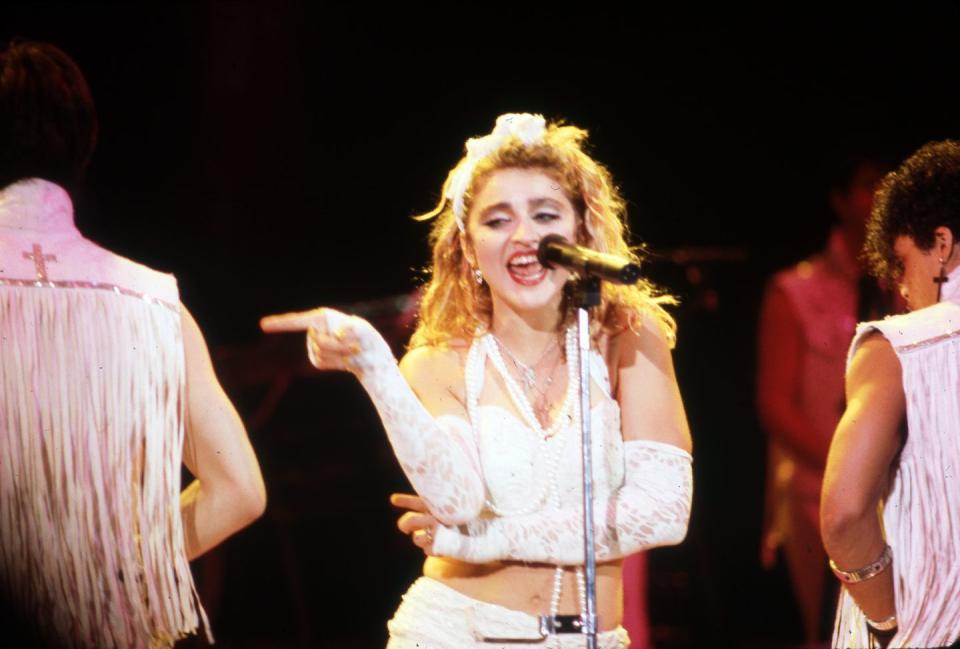 detroit   may 25  american, singer, songwriter and actress, madonna, on stage during the virgin tour on may 25, 1985, at cobo arena in detroit, michigan  photo by ross marinoicon and imagegetty images