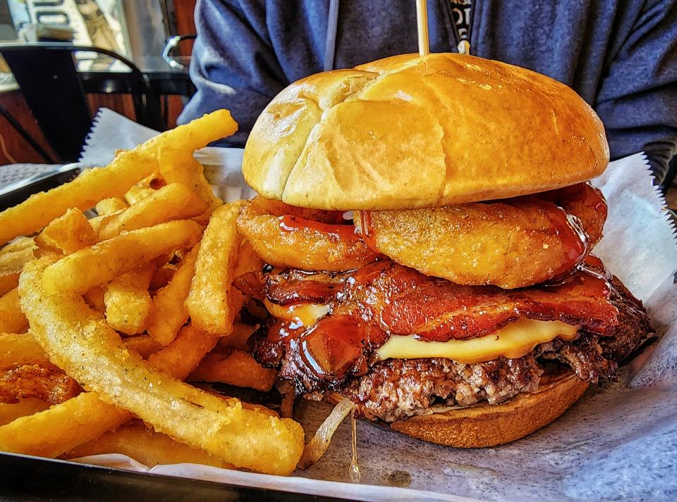 Mouthole Smashburgers and BBQ serves a variety of burgers including The Gouda Smash with onion rings, bacon, barbecue sauce and smoked gouda, pictured here.