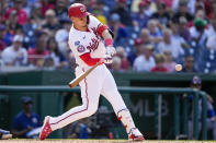 Washington Nationals designated hitter Joey Meneses hits an RBI-double during the third inning of a baseball game against the New York Mets at Nationals Park, Monday, May 15, 2023, in Washington. (AP Photo/Alex Brandon)
