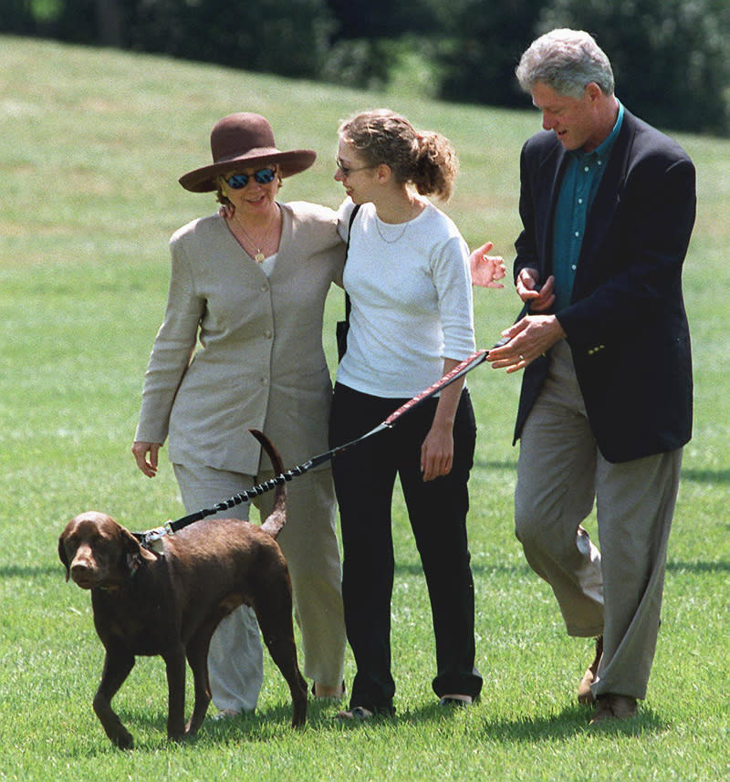 Hillary Clinton wearing a sun hat and suit with her family on August 30, 1994