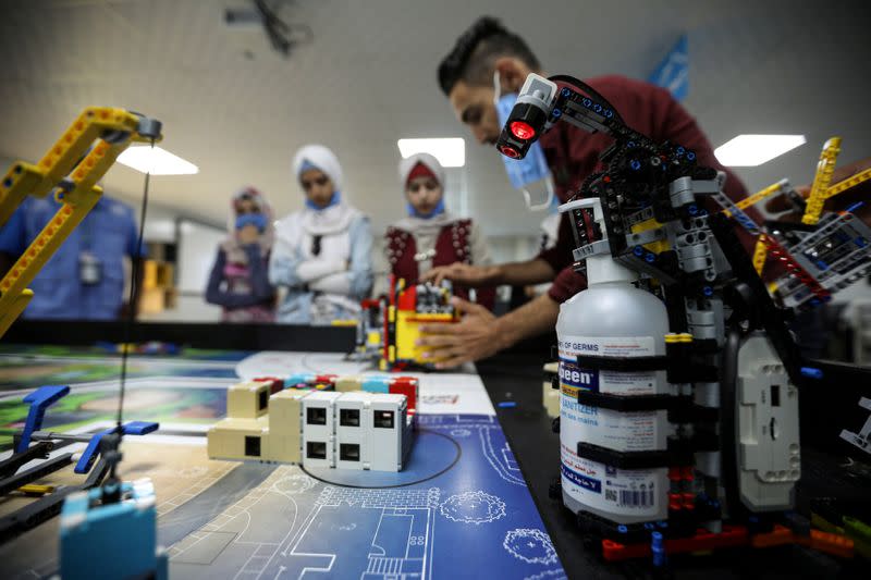 FILE PHOTO: Teenagers at the Syrian refugee Zaatari camp develop lego-based robots