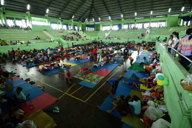 People wait inside an evacuation centre in Klungkung regency, on the Indonesian resort island of Bali on September 25, 2017