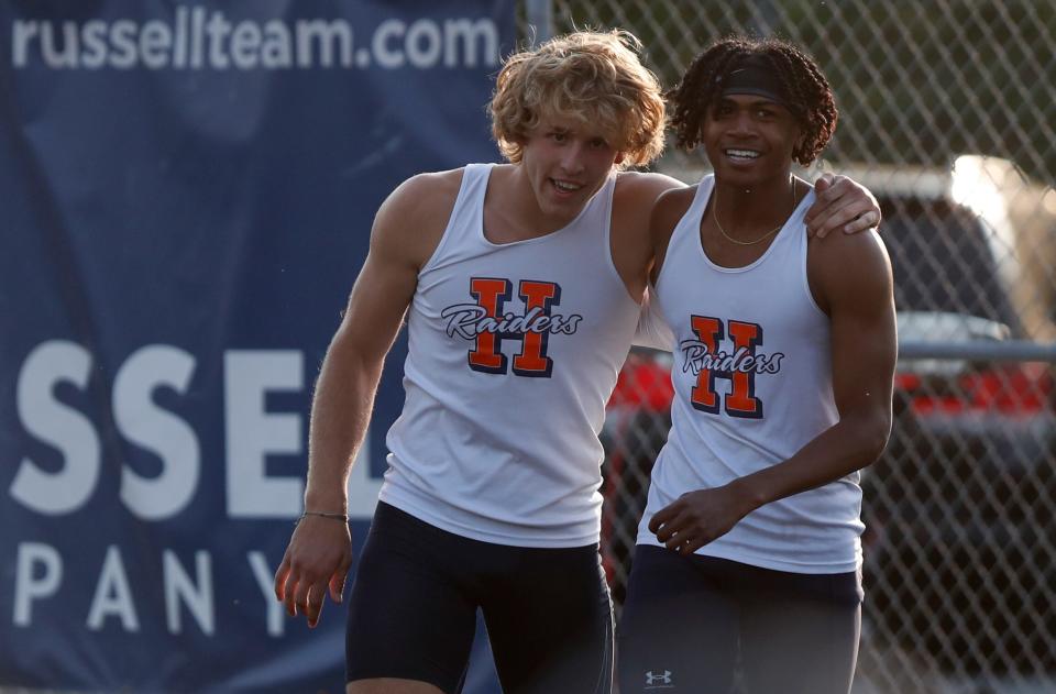 Harrison Finley Huber and Elija Strong hug after racing in the 100 meter dash during the IHSAA boys track and field sectional meet, Thursday, May 18, 2023, at West Lafayette High School in West Lafayette, Ind.