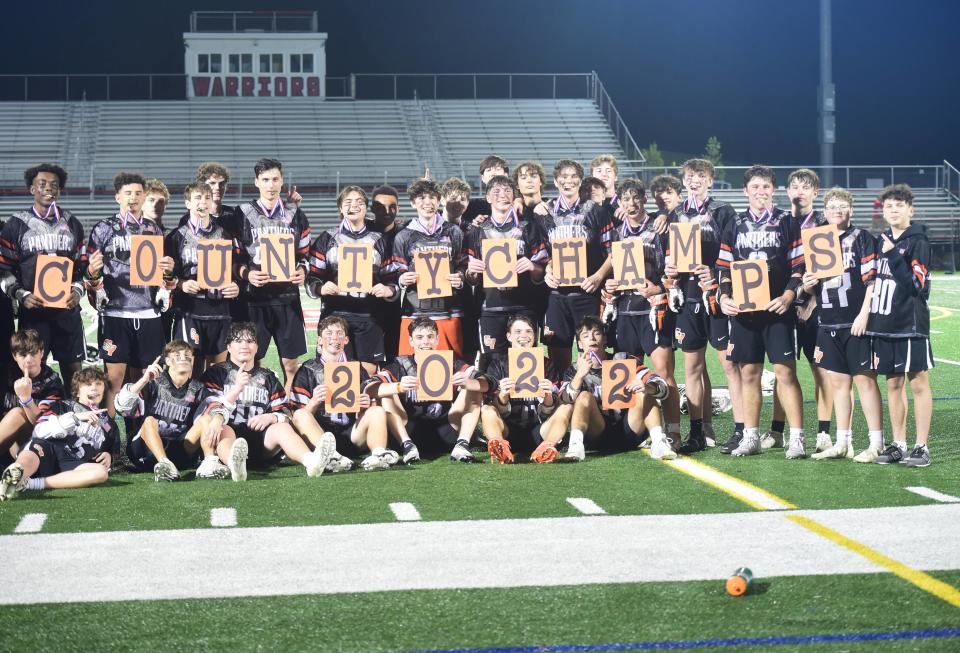 The Central York boys' lacrosse team poses for a photo after beating Susquehannock, 10-4, for the YAIAA title on May 13, 2022.