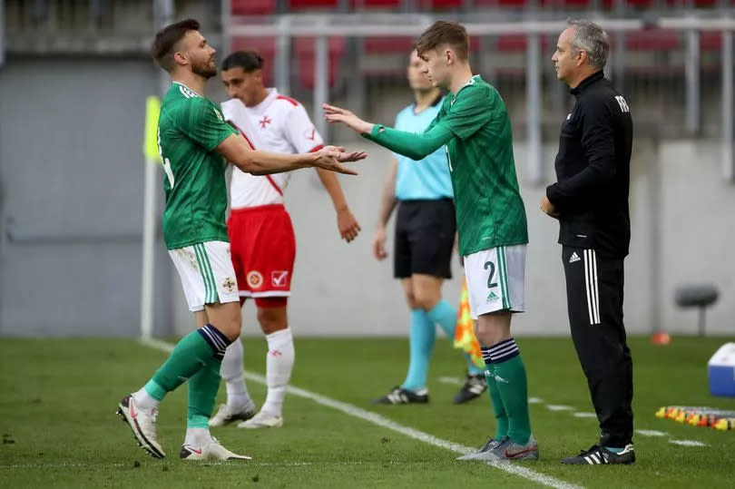 A picture of Conor Bradley replacing Stuart Dallas when coming on for his Northern Ireland debut