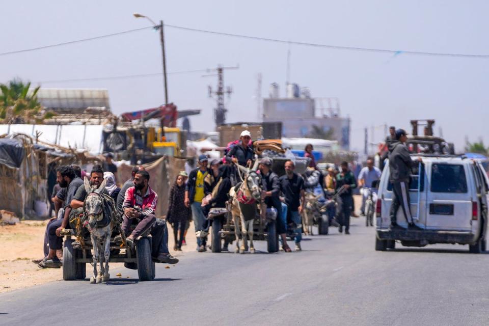 Displaced Palestinians arrive in central Gaza after fleeing from the southern Gaza city of Rafah in Deir al Balah, on May 9, 2024. (Copyright 2024 The Associated Press. All rights reserved.)