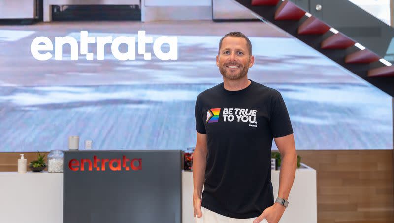 Adam Edmunds, CEO of Entrata, poses for a photo in the lobby of the company’s headquarters in Lehi on Friday, Aug. 12, 2022. Entrata announced it has acquired Rent Dynamics.